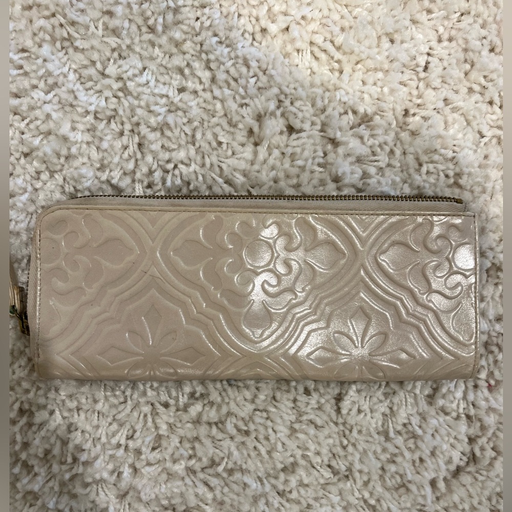 Hobo embossed ivory leather clutch.